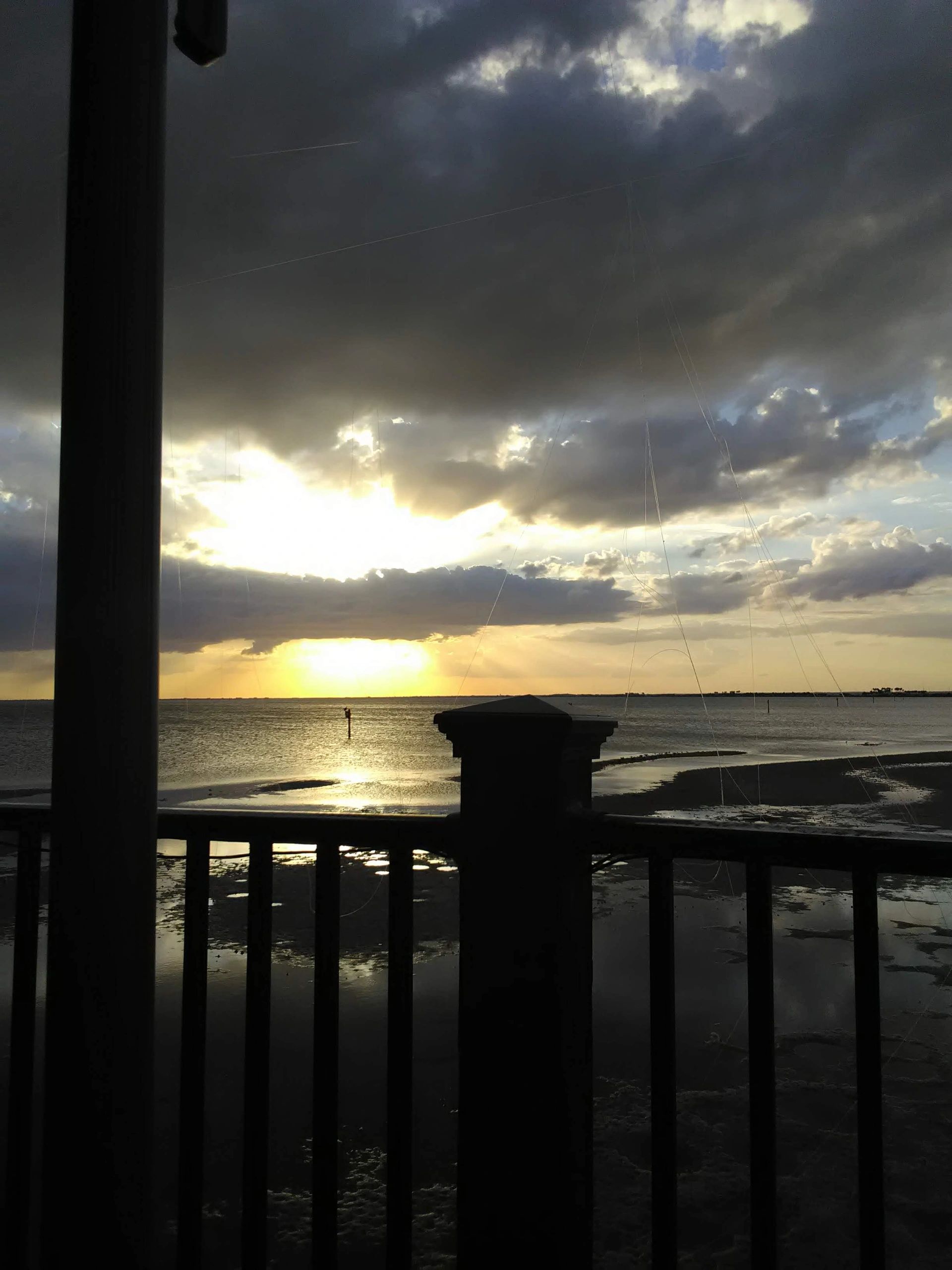 Coastal sunset from wooden pier