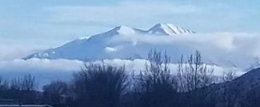 Snow-capped mountain in mist